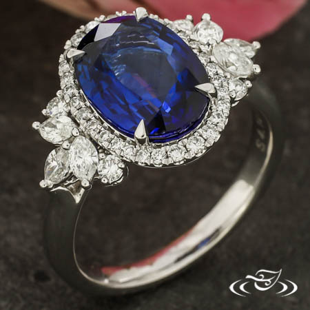 18Kw 4.14Ct Oval Sapphire And 0.70Ctw Diamond Halo Ring